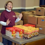 Karen Christiensen helps out with Lemoore Christian Aid at Reasons for the Season.